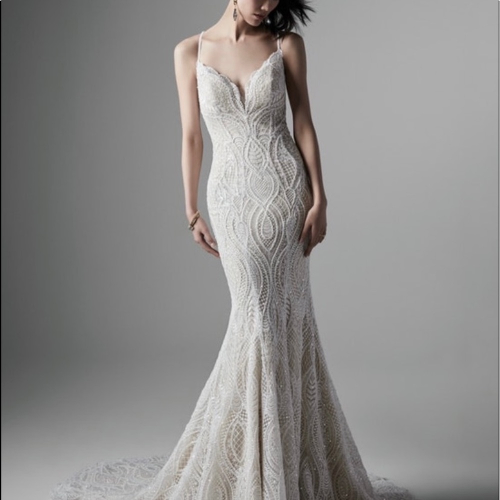 Never taken out of the original packaging.  Ivory over nude.  “Daxton”.